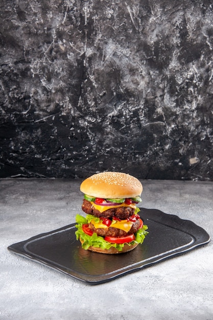 Vertical view of delicious sandwich on gray ice distressed isolated surface