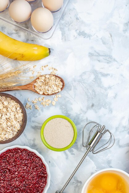 Vertical view of free space and fresh healthy food set on two-toned white blue surface