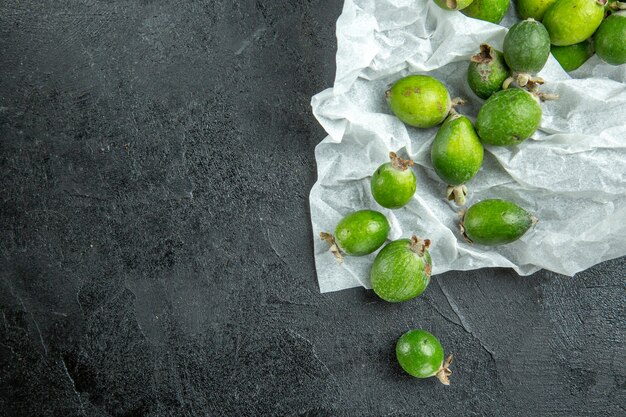 Vertical view of natural fresh green feijoas lying