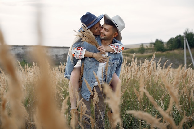 Very beautiful couple in a wheat field