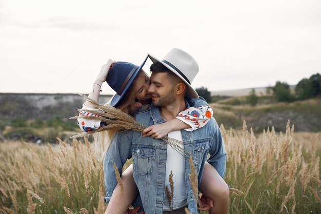 Very beautiful couple in a wheat field