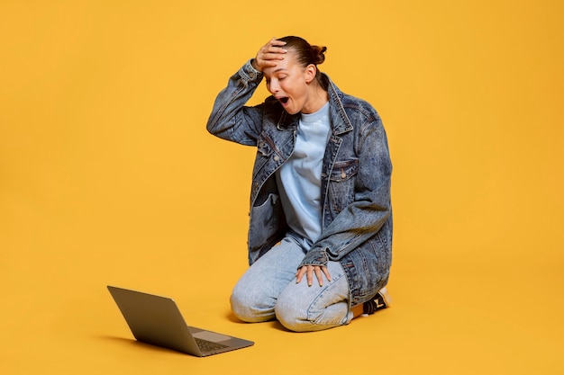 Very happy woman looking at laptop