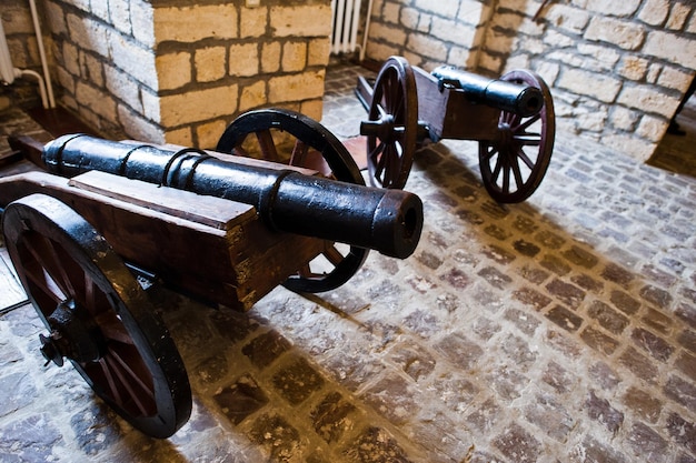 Very old cannon made of iron in museum