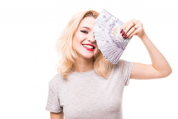 Very rich smiling woman cover her pretty face with money