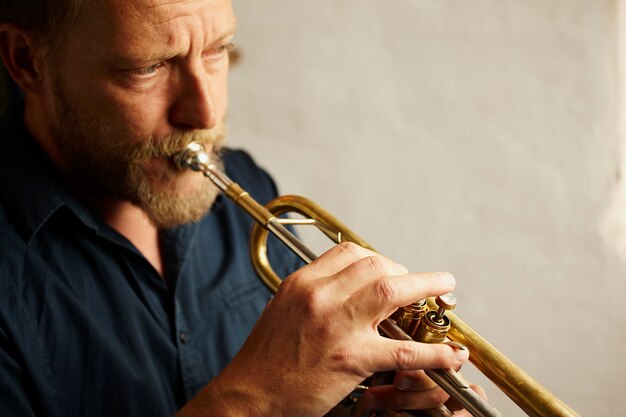 veteran musician playing the trumpet