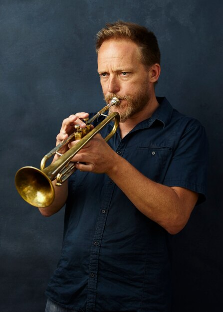 veteran musician playing the trumpet