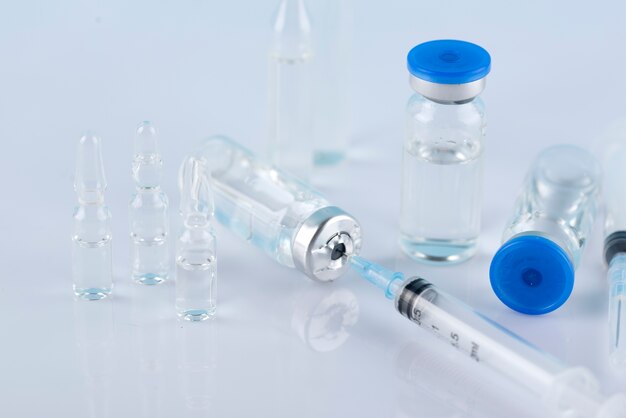 Vials and syringes arrangement high angle