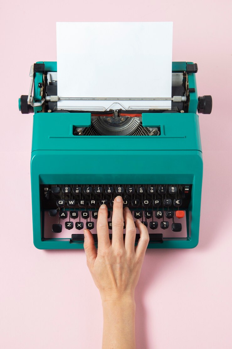 Free Photo vibrantly colored retro typewriter with keyboard and buttons
