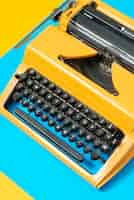 Free photo vibrantly colored retro typewriter with keyboard and buttons