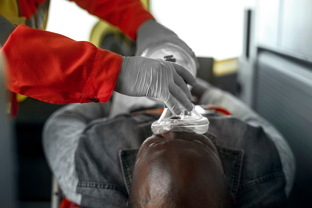 Free photo victim with oxygen mask high angle