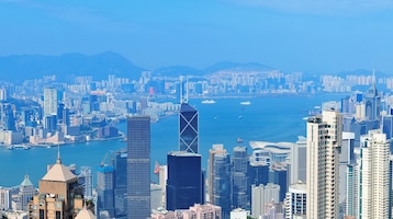 Victoria harbor aerial view with hong kong skyline and urban skyscrapers in the day.