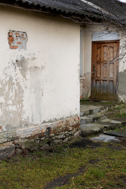 View of abandoned and decaying house in nature