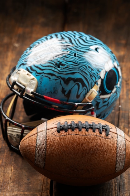View of american football ball with helmet