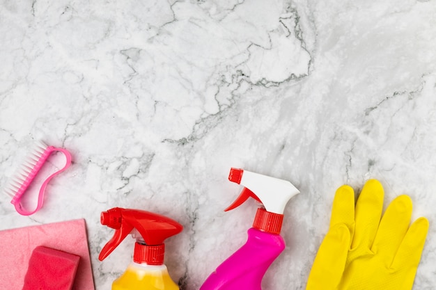 Above view arrangement with cleaning products on marble table