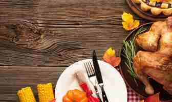 Free photo above view arrangement with delicious meal on wooden background