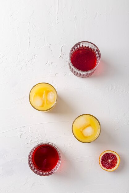 Above view arrangement with different colored drinks