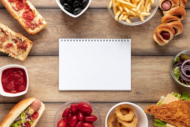 Above view arrangement with food and notebook