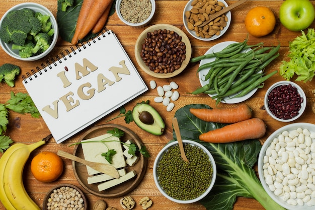 Above view arrangement with healthy food on wooden background