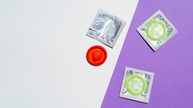 Above view arrangement with red and green condoms