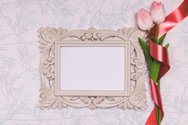 Above view arrangement with tulips and frame