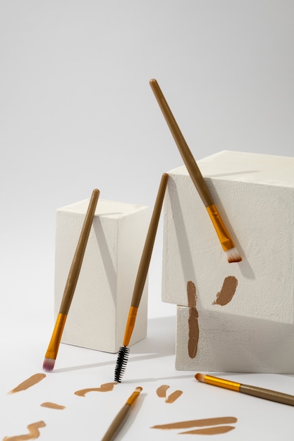 View of assortment of brushes with brown paint