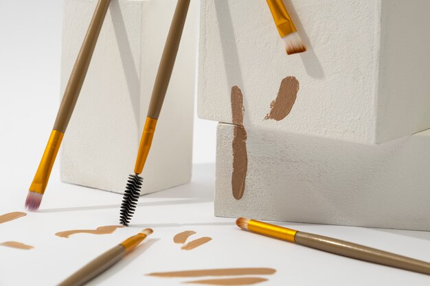 View of assortment of brushes with brown paint