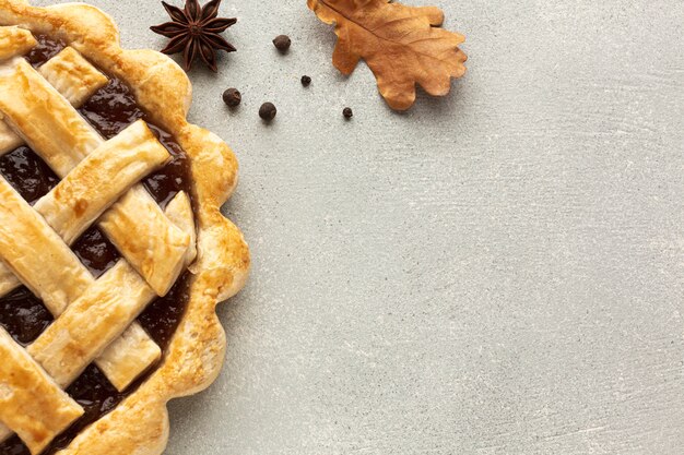 Above view assortment with sliced pie and leaves