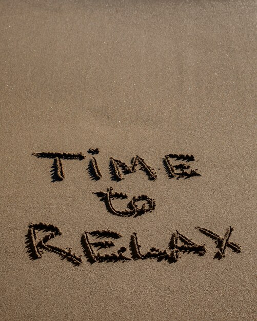 View of beach sand in summertime with message written in it