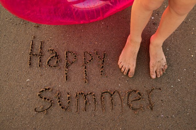 View of beach sand in summertime with message written in it