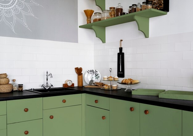 View of a beautifully decorated green kitchen