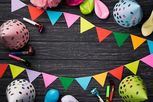 Free photo above view birthday decorations on wooden background