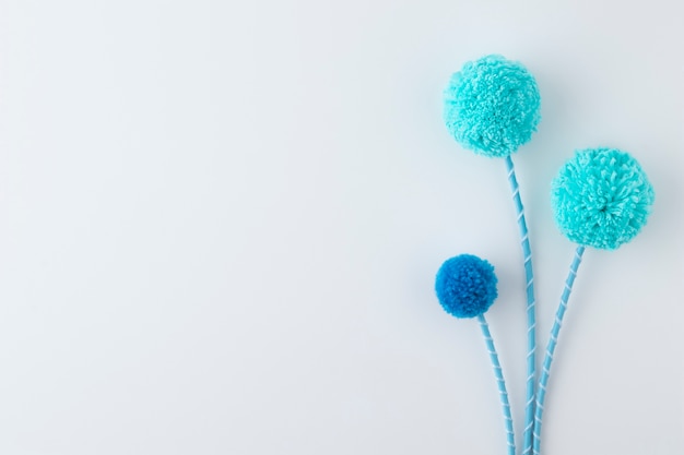 Above view blue pom poms with copy space