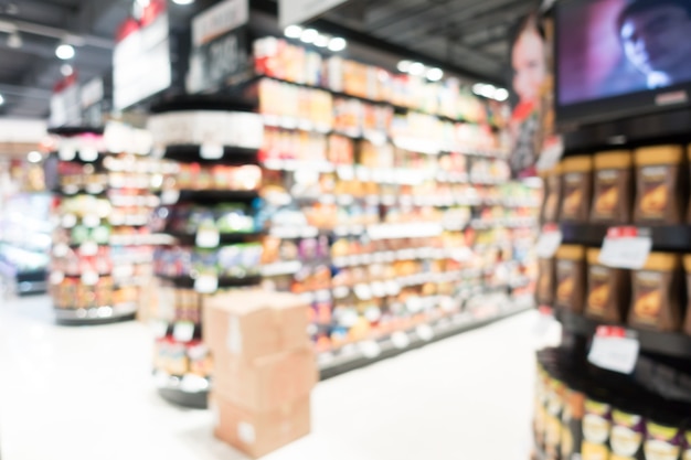 View of blurred supermarket with cardboard boxes