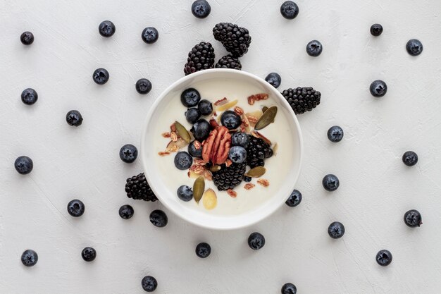 Above view bowl with yogurt and fruits