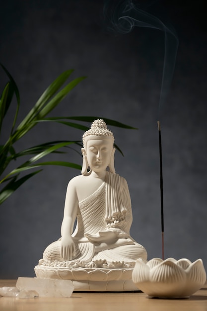 Free photo view of buddha statuette with incense