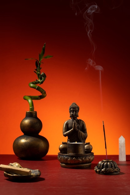 View of buddha statuette with incense