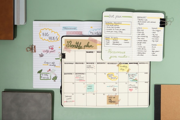 Free photo above view bullet journals and paper clips