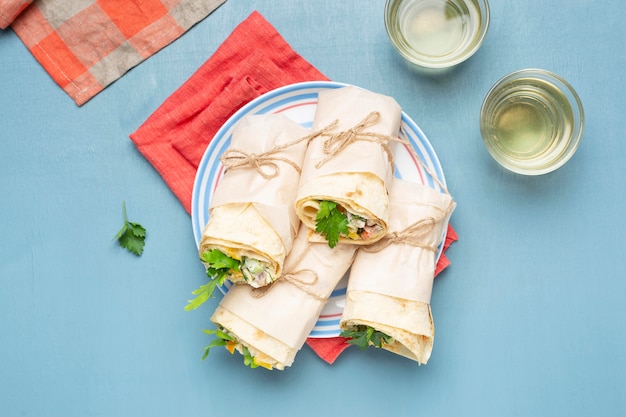 Free photo above view burritos on plate