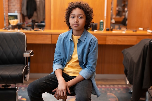 Free photo view of child at the hair salon