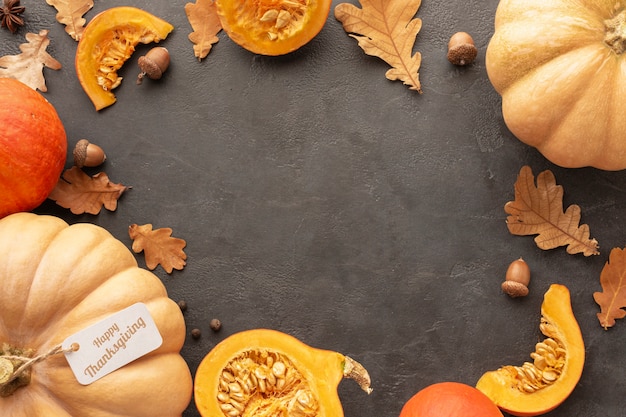 Above view circular frame with pumpkins on stucco background