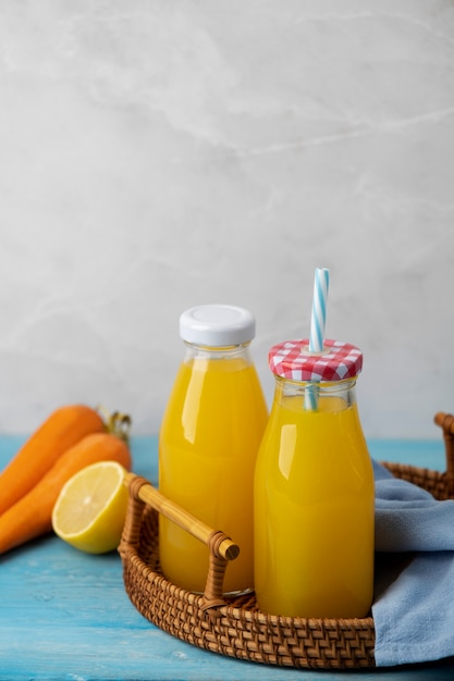 View of citrus and carrots drinks