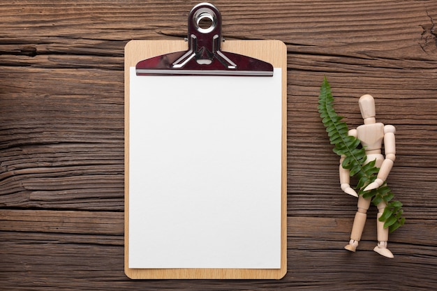 Above view clipboard and plant arrangement