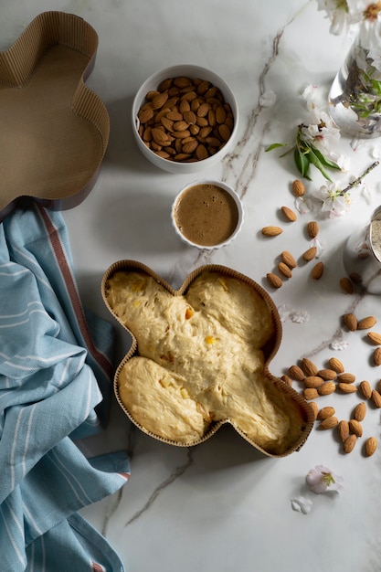 Free photo above view colomba dough and almonds