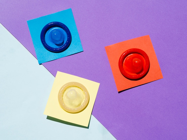 Free Photo above view condoms on colourful background