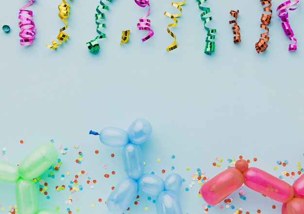 Above view decoration with colorful confetti and balloons