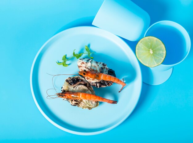 Above view decoration with shrimps on blue plate