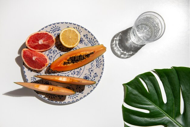 Free photo above view delicious fruits on white background