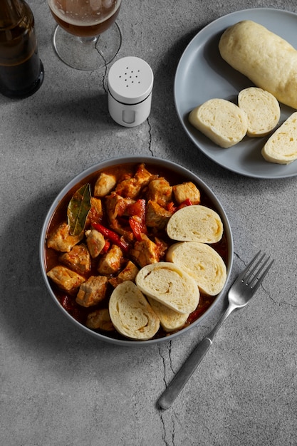 Free photo above view delicious goulash and bread