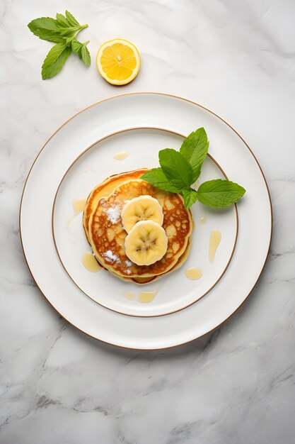 View of delicious pancakes with bananas