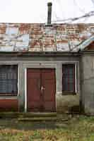 Free photo view of deserted and decaying house in nature